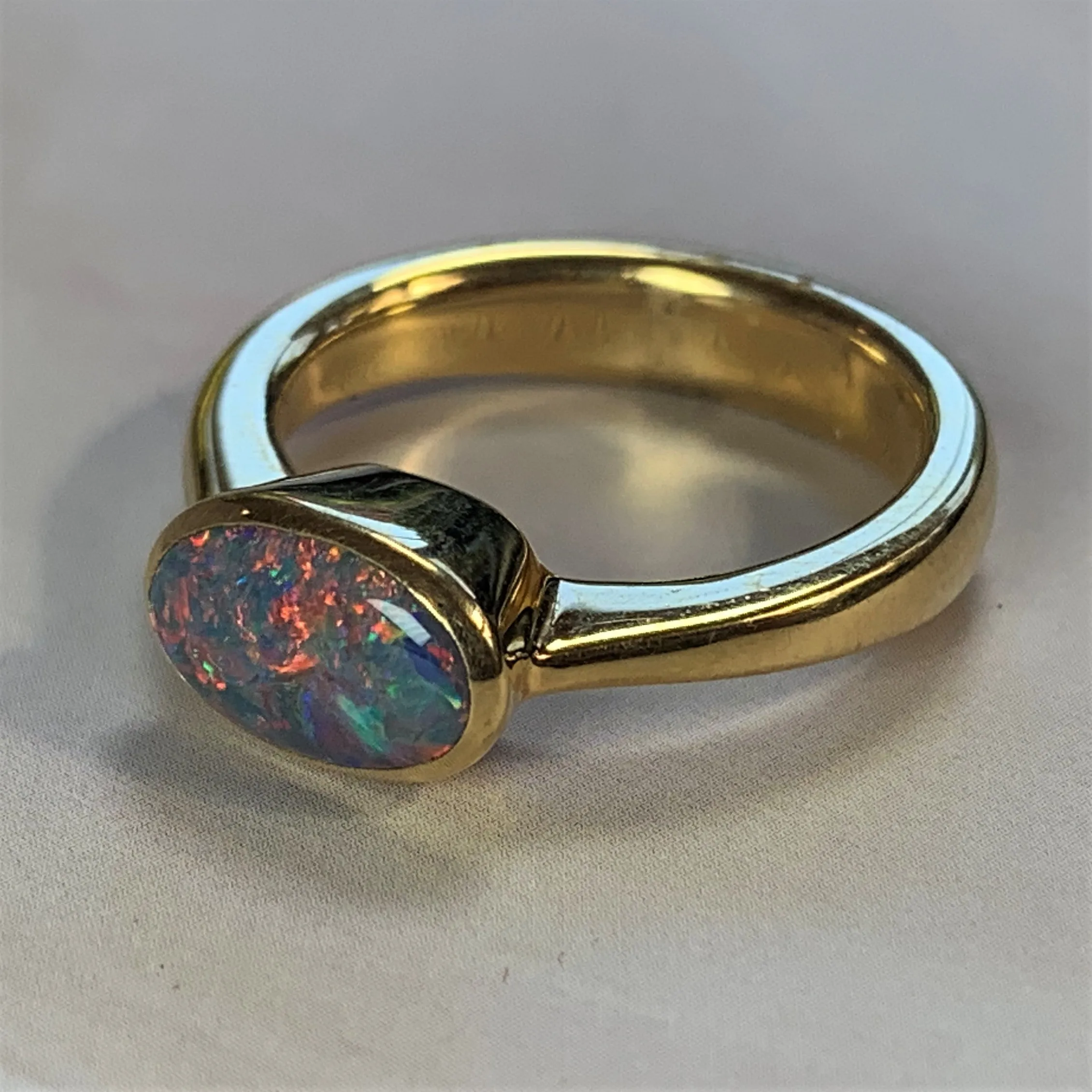 18kt Yellow Gold Black Opal 1.2ct bezel set