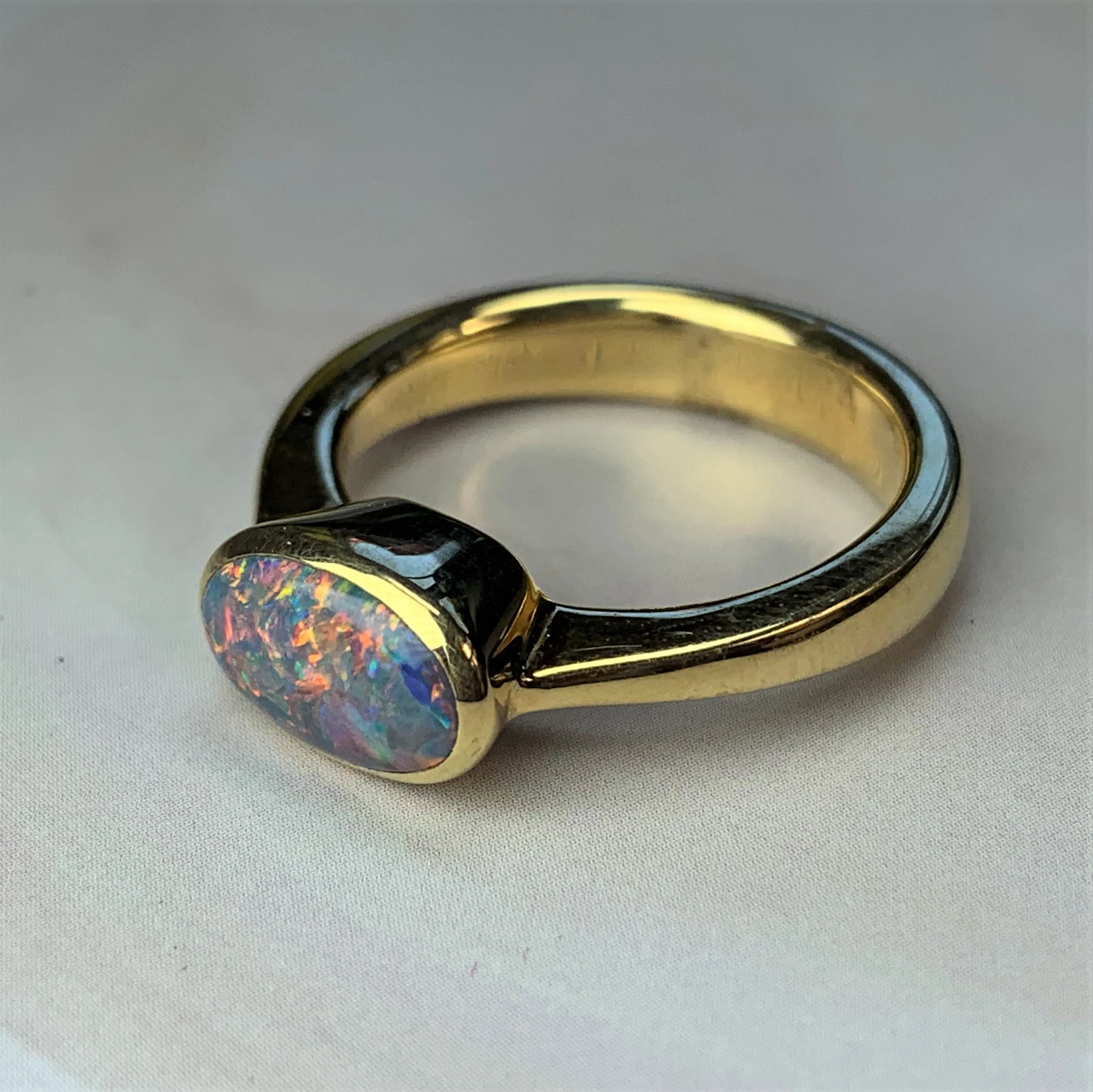 18kt Yellow Gold Black Opal 1.2ct bezel set